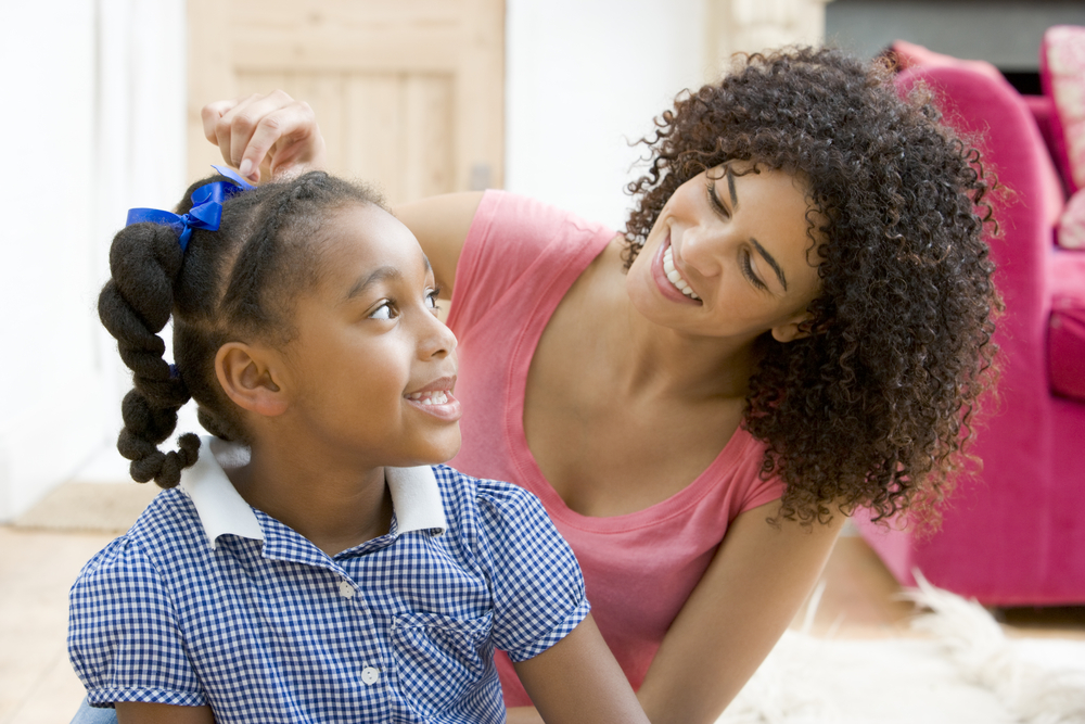 Mom doing daughter's hair