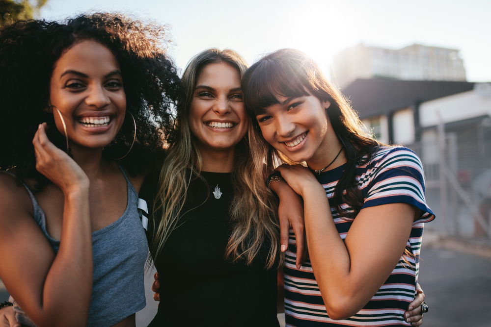 friends laughing and smiling together