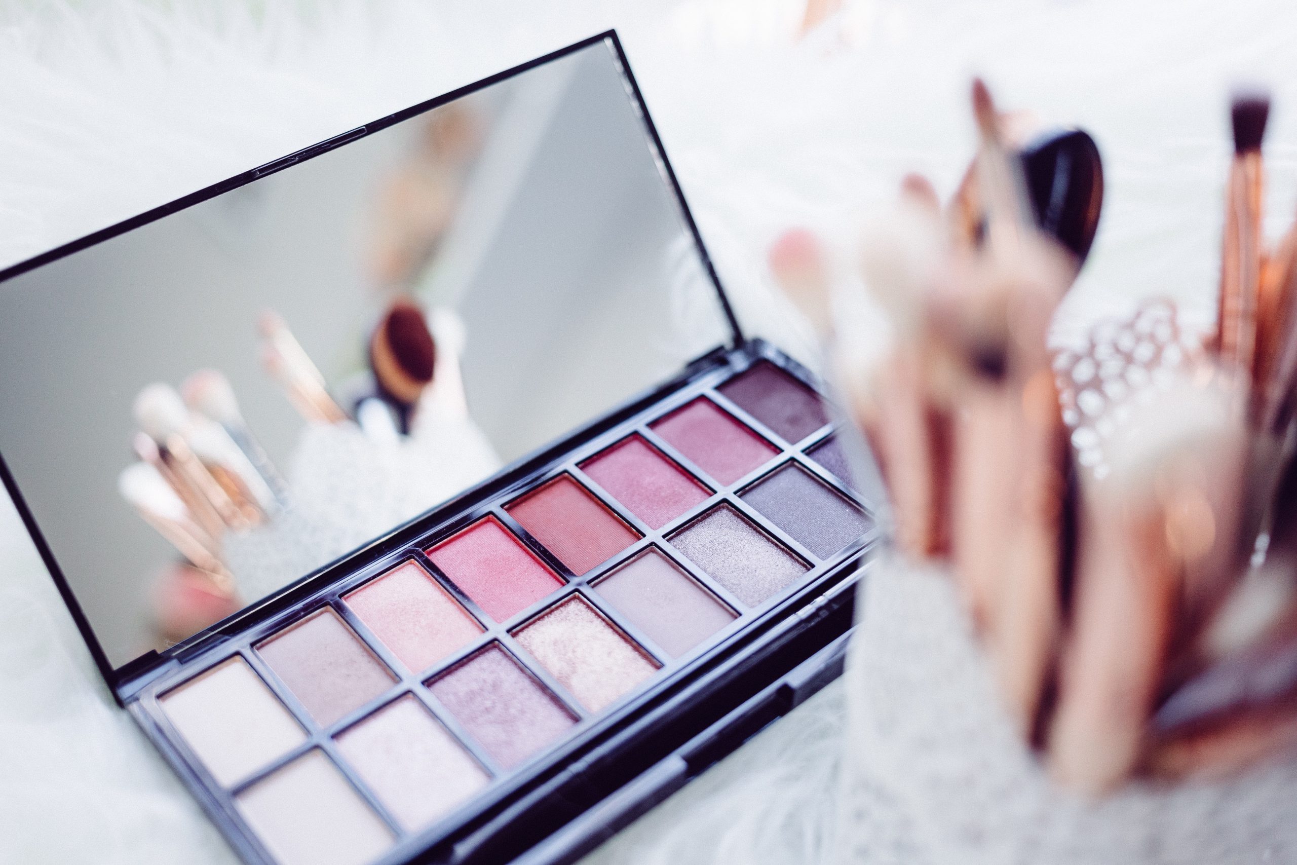 a makeup palette and tools on a table