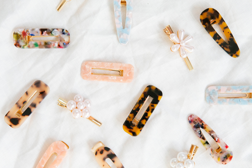 hair clips and barrettes laid out on a table