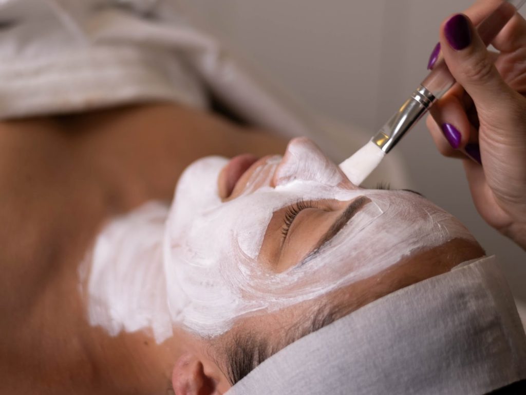 Woman at a spa getting a facial