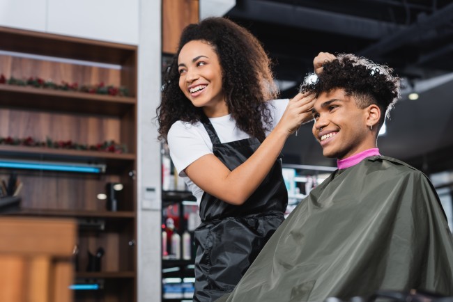 hairstylist cutting man's hair