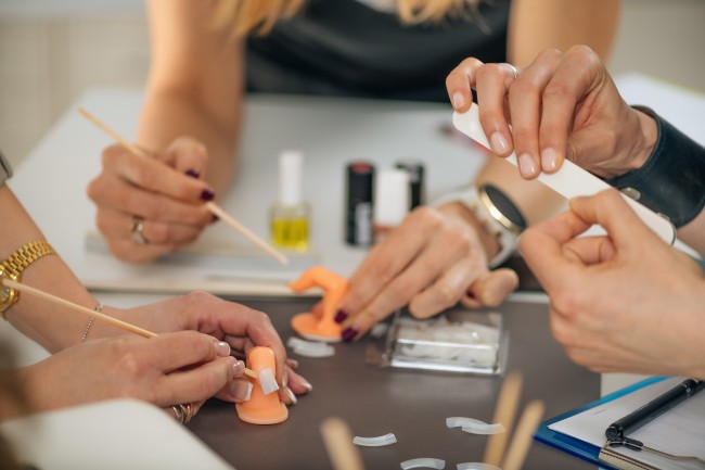 nail technicians practicing