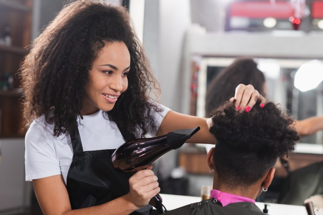 girl blowdrying man's hair